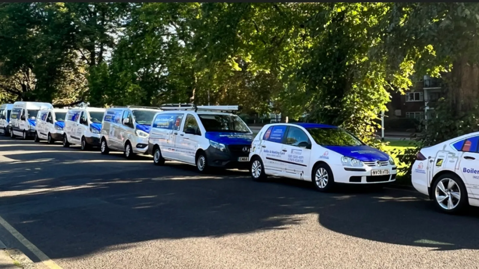 Boiler & Heating Care branded vans parked in a row